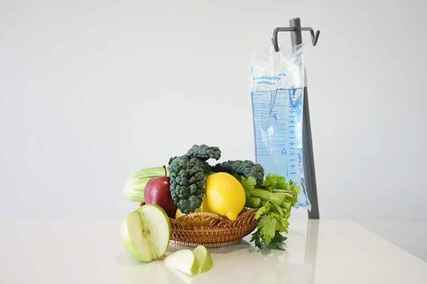 Basket Of Fruits and Hydration Room IV Fluid Bag