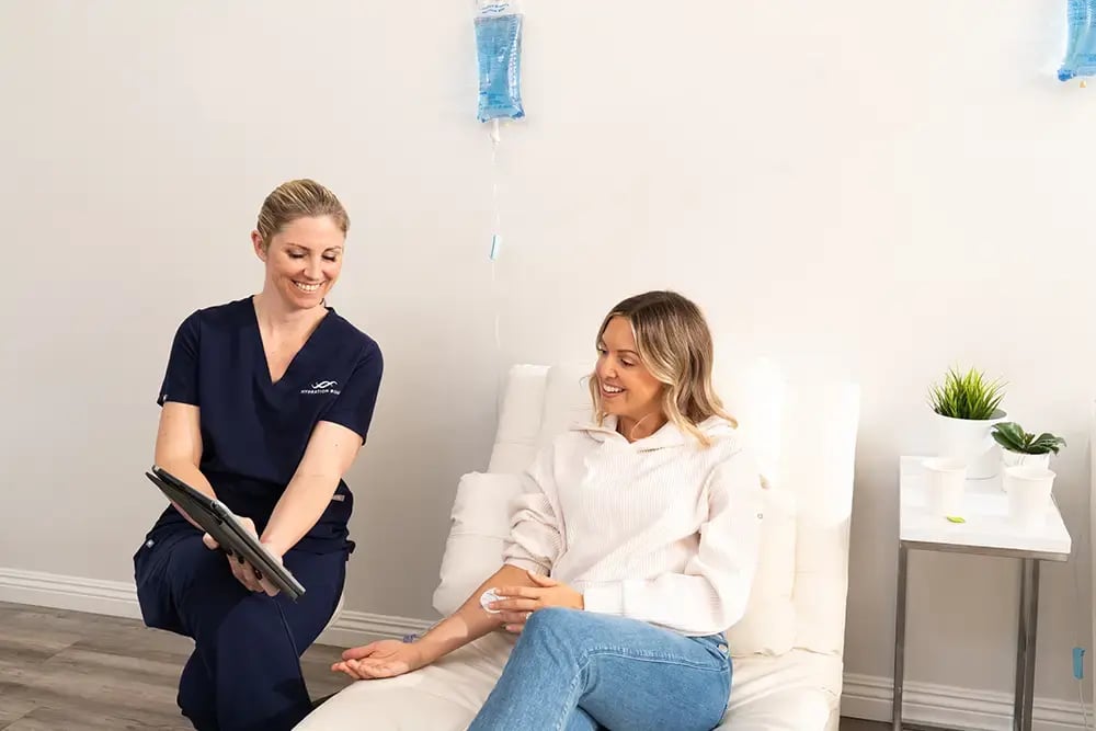 Hydration Room Nurse Going Through Ipad with Patient