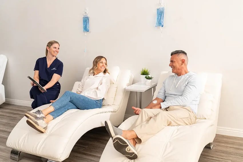 Hydration Room Nurse Talking With IV Therapy Patients