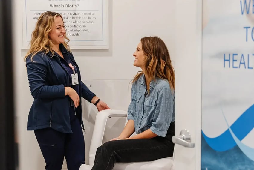 Hydration Room Nurse and Patient Happily Talking During Consultation