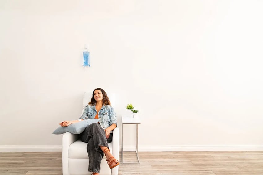 Hydration Room Patient Relaxing While Receiving Vitamin IV Therapy