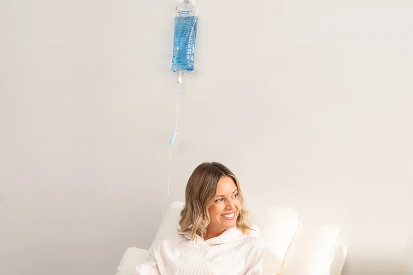 Hydration Room Patient Smiling While Receiving IV Treatment