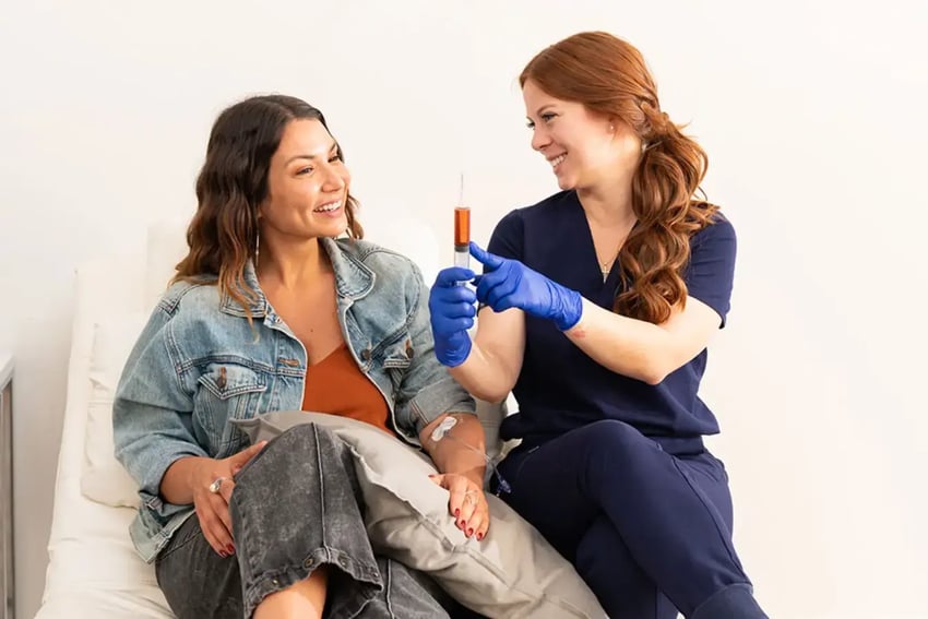Hydration Room Patient and Nurse Talking About Vitamin IV