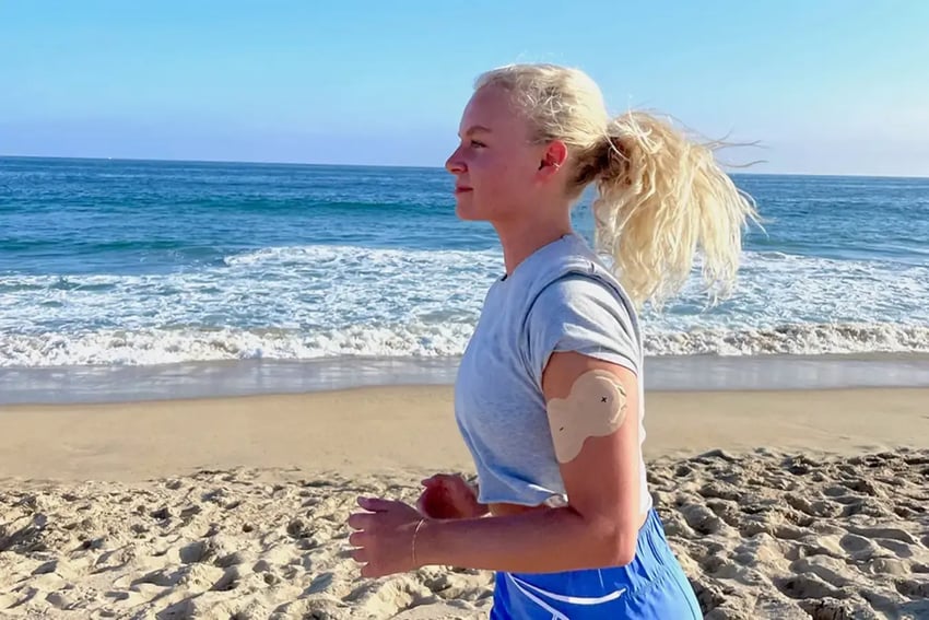 Patient running on beach while wearing NAD+ patch