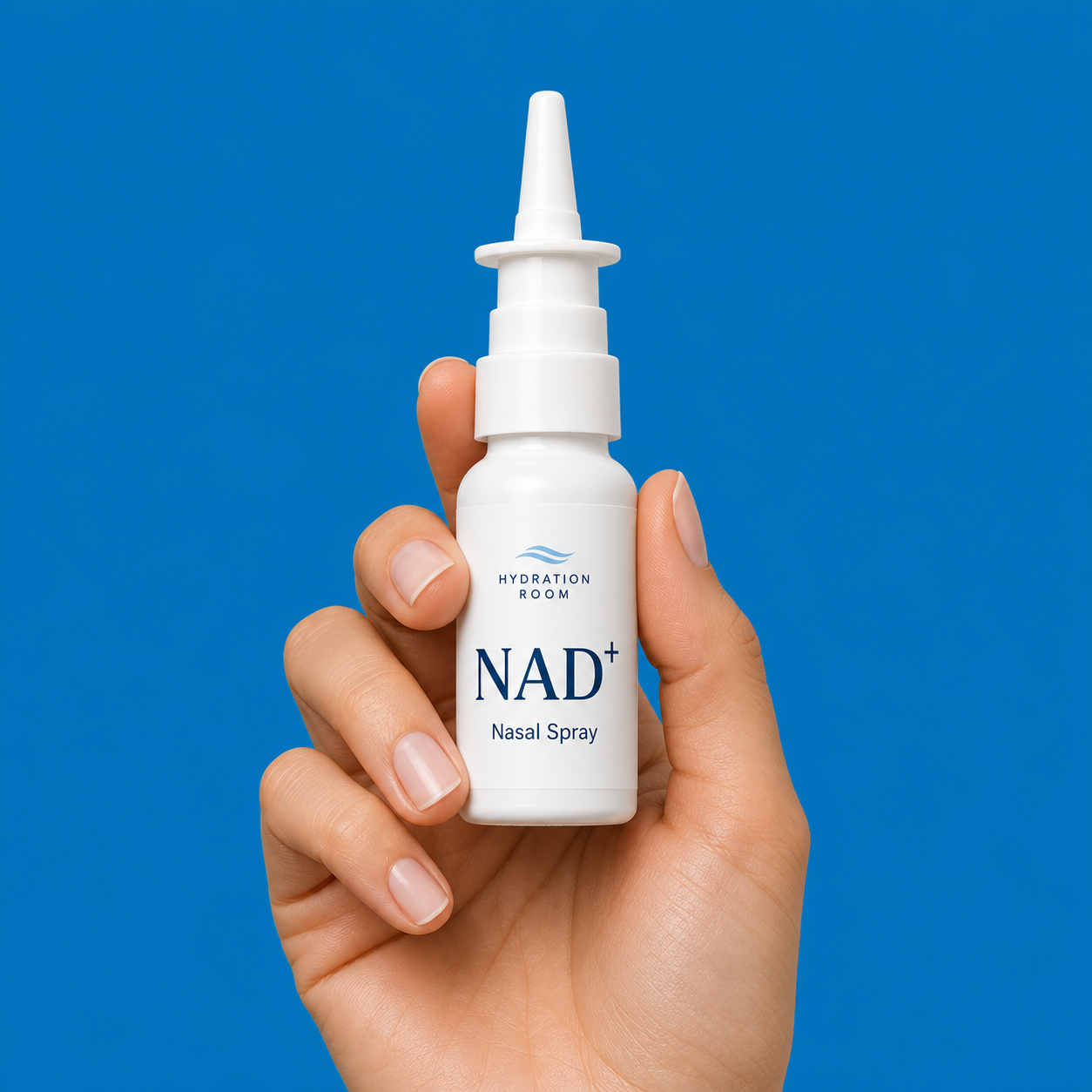 NAD+ Nasal Spray bottle on a blue studio background.