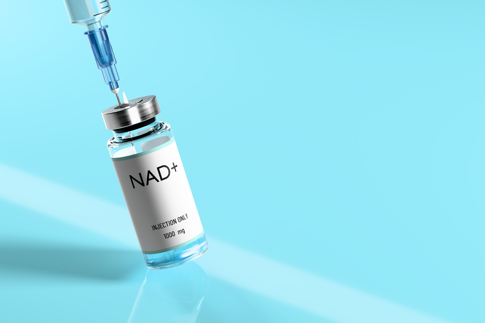 Syringe and vial of NAD+ for injection on a blue background