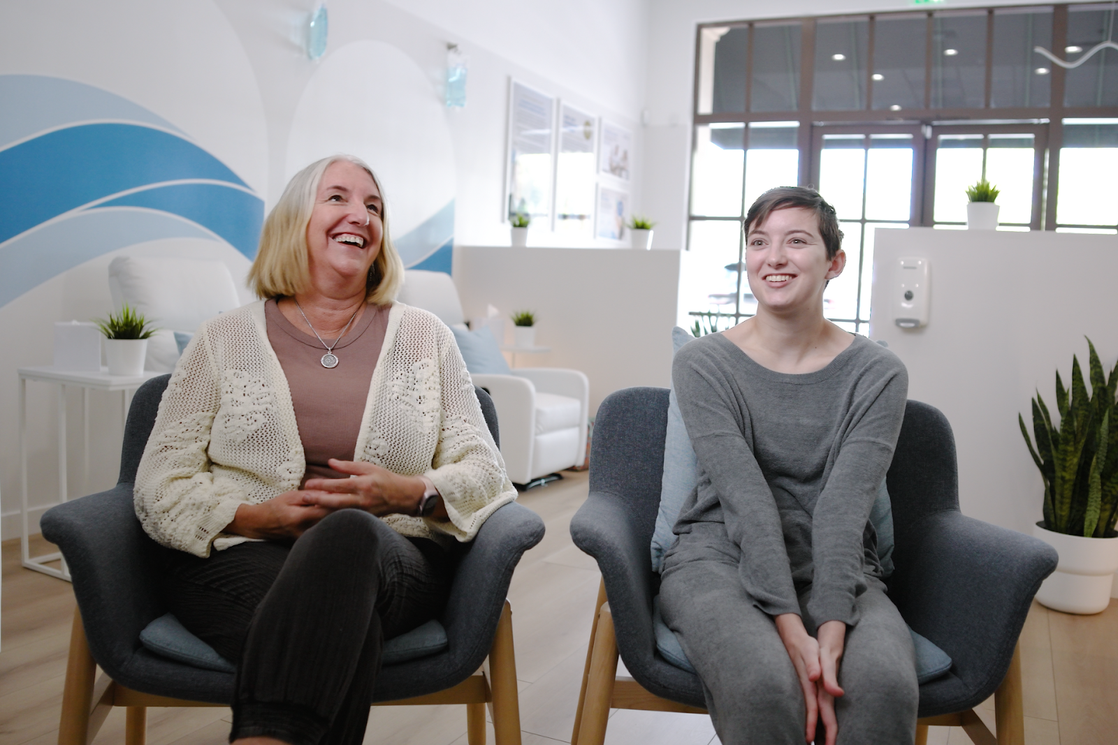Hallie and her mother chatting and laughing