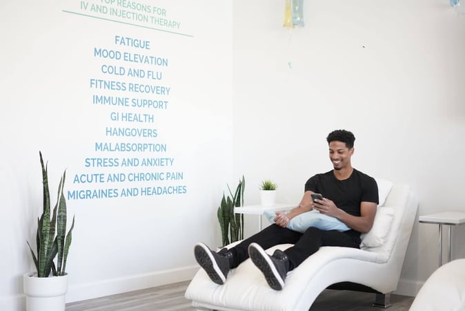 A man getting IV nutrient therapy at Hydration Room