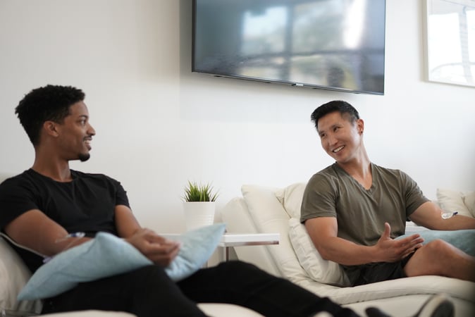 Two men getting muscle soreness recovery IV at Hydration Room