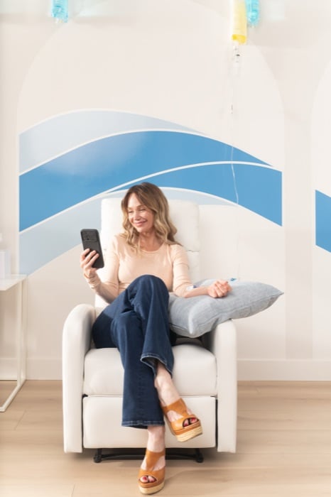 Patient relaxing in a Hydration Room treatment chair